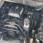 Mercury MerCruiser 5.7-litre marine engine with belt-driven pulleys and various hoses visible in the engine bay.